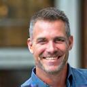 Portrait of David L., a fit man in his late 40s from Denver, smiling confidently.