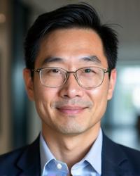 Headshot of Michael Chen, a man in his early 40s with a thoughtful, reassuring expression and a keen intellect, suitable for a sleep coach.